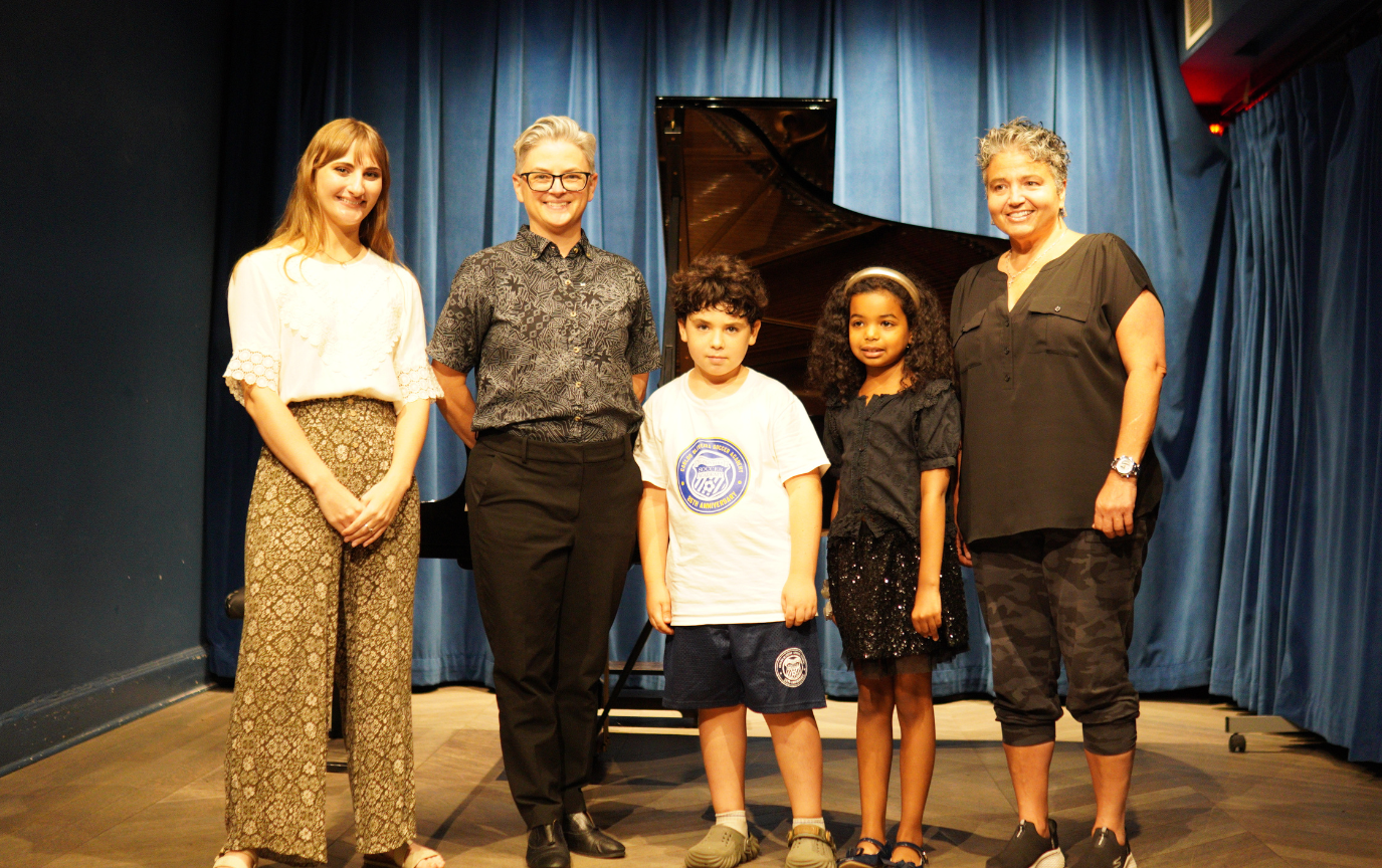 Executive Director Rachel Black with students and community members at Bloomingdale School of Music